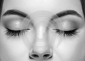 Closed woman eyes nose studio black and white