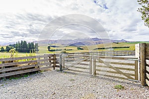 Closed wooden farm gate at the entrance to a farm