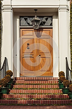 Closed wooden front door of an upscale home