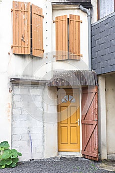 Closed wooden shutters of a french cottage