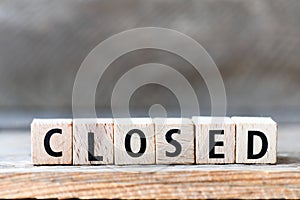 CLOSED. Word arranged from wooden letters Closed