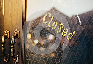 Closed word, sign on vintage board of the jeans shop
