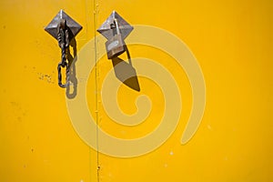 Closed yellow doors with lock