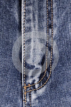 Closed zipper on blue jeans. Vertical Orientation