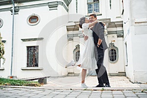 Closeness of the people. Beautiful bride with his fiance is celebrating wedding outdoors