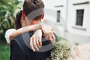 Closeness of the people. Beautiful bride with his fiance is celebrating wedding outdoors