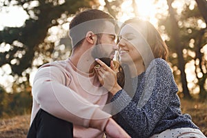 Closeness of the people. Cheerful lovely young couple having a rest outdoors together