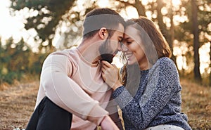 Closeness of the people. Cheerful lovely young couple having a rest outdoors together