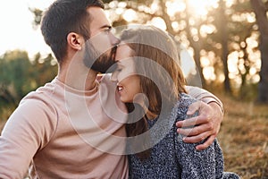 Closeness of the people. Cheerful lovely young couple having a rest outdoors together