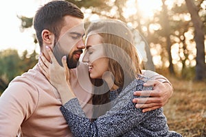 Closeness of the people. Cheerful lovely young couple having a rest outdoors together