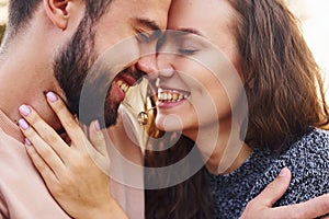 Closeness of the people. Cheerful lovely young couple having a rest outdoors together