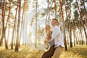 Closeness of the people. Happy couple is outdoors in the forest at daytime