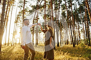 Closeness of the people. Happy couple is outdoors in the forest at daytime