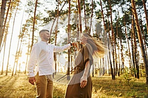Closeness of the people. Happy couple is outdoors in the forest at daytime