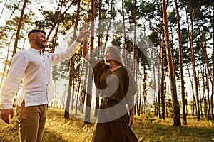 Closeness of the people. Happy couple is outdoors in the forest at daytime