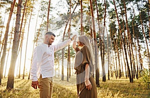 Closeness of the people. Happy couple is outdoors in the forest at daytime