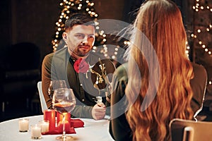 Closeness of the people. Young lovely couple have romantic dinner indoors together