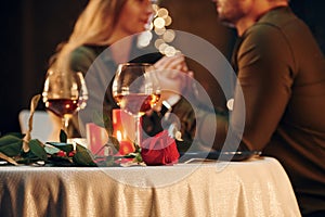 Closeness of the people. Young lovely couple have romantic dinner indoors together