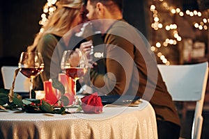 Closeness of the people. Young lovely couple have romantic dinner indoors together