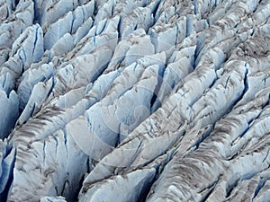 Closer (Aerial) View of Icy Blue Color Crevasse of Glacier