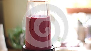 A closer look at making a protein shake with bananas milk and berries,