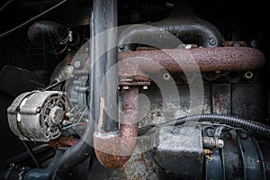 A closer look at an old tractor engine.