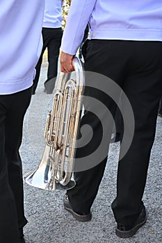 Closer to the hands of people holding musical instruments such as blower Most will be used in the marching band.