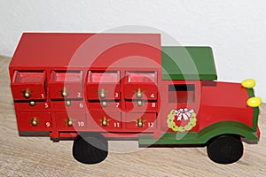 Closer and top view on a colorful wooden truck as an advent calendar in niederlangen