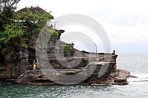 A closer view of Tanah Lot, a Balinese Hindu temple on top of cliff and rock formation.