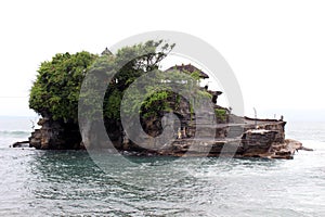 A closer view of Tanah Lot, a Balinese Hindu temple on top of cliff and rock formation.