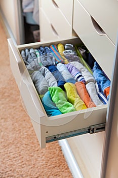 Closet with children`s things. Storage of children`s clothes.