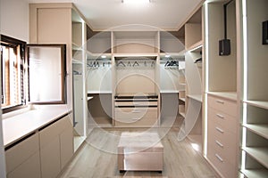 Closet room with plenty of space for clothes and shoes in a home