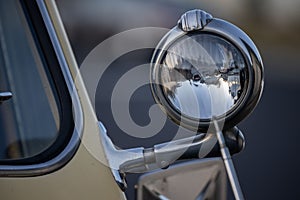 Closeup of a 1950 Willys Jeepster headlight