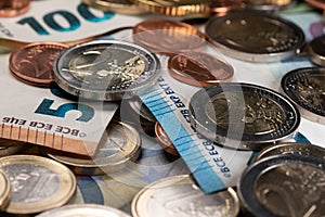 Closeup of 2 Euro coins and one and two cents. European banknotes . Money and Cash