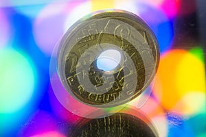 Closeup of 25 Spanish Pesetas coin on a bokeh background