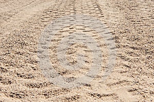 Closeup of 4x4 tyre tracks in the desert