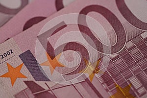closeup 500 euro banknotes of european union, concept of savings, banking, tax payment, economic cooperation, actual problems of