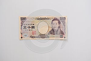 Closeup of 5000 Yen bank note with copy space