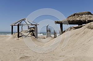 Closeup of abandoned tents on the beach during the out of season period