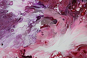 Closeup on an abstract acrylic pour painting of a clashing tempest, done in shades of red, purple, and white.