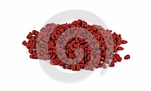 Closeup of achiote seeds over white background