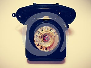 A vintage and antique telephone with white background. photo