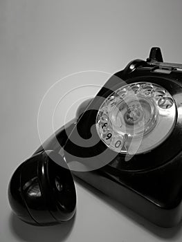 A vintage and antique telephone with white background. photo