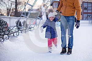 Closeup of adorable little girl with young dad on