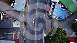 Closeup aerial view of asphalt road on a street of asian city with left side traffic