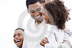 Closeup African-American father laughing with kids