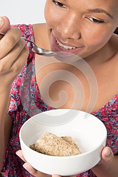 Closeup, African American Female eating breakfast