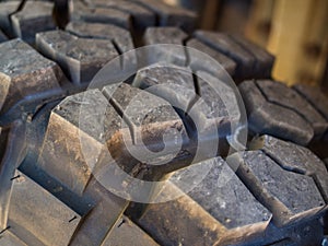 Closeup of aggressive offroad mud tire tread on 4x4