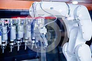 Closeup AI robot for working in industrial food factory packaging ice cream, Automated production line