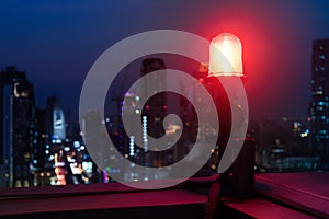 Closeup of an aircraft warning light on top of a highrise